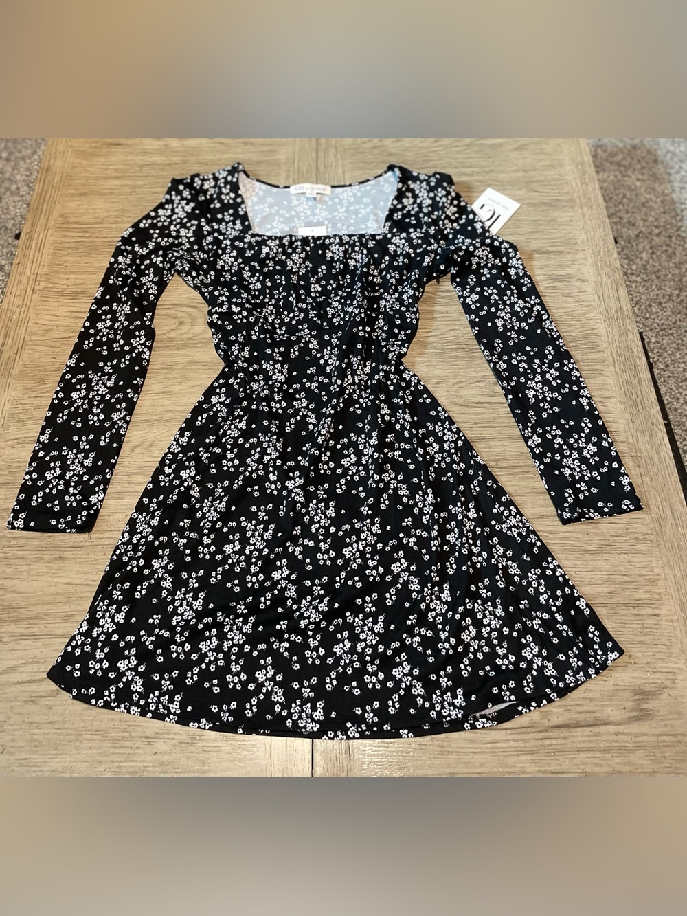 Lola Grace long sleeved black dress with white flowers, size medium. NWT